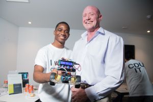 Student showing his robot project